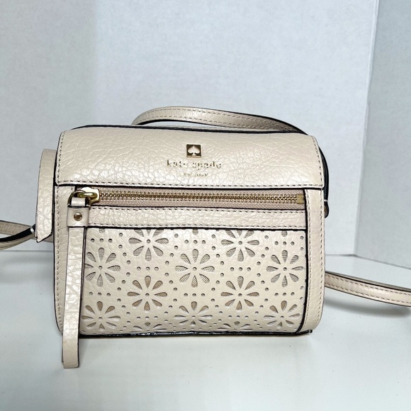 Kate SpadePerforated design ivory crossbody